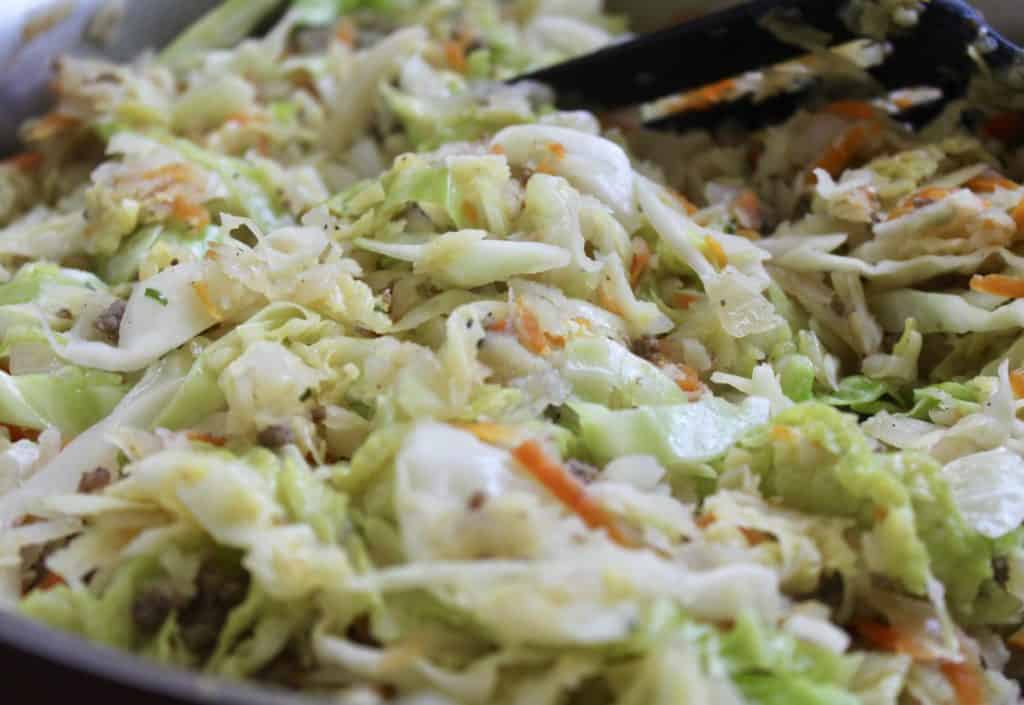 cabbage and vegetables in a pan