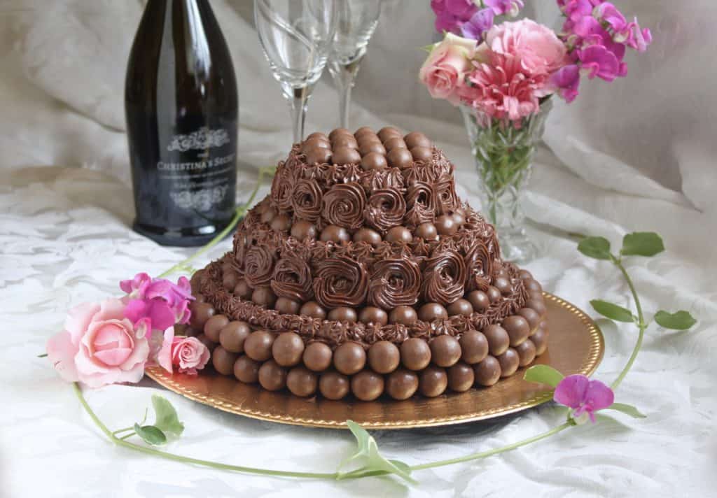 Maltesers chocolate buttermilk cake with Prosecco bottle and flowers