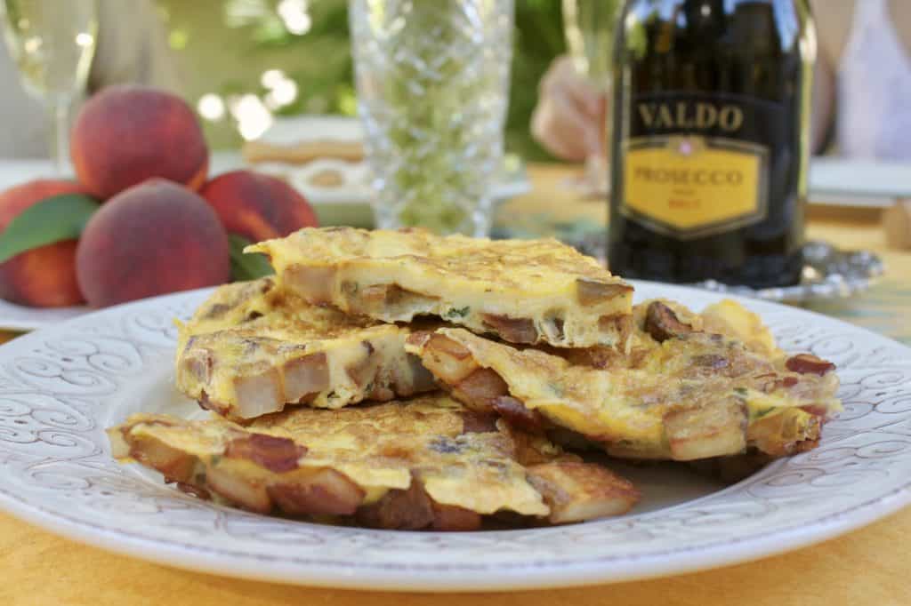 Frittata on brunch table with Valdo Prosecco