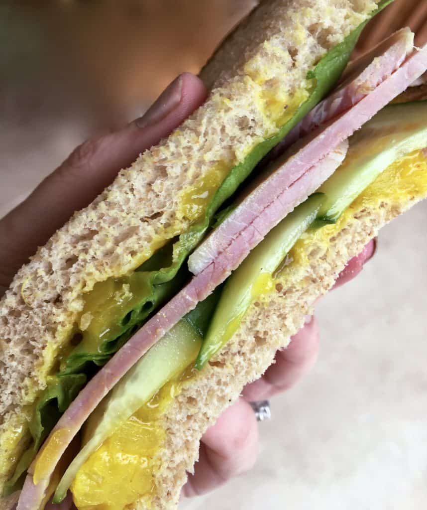 close up of Ham, piccalilli and cucumber sandwich