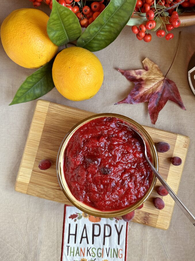 overhead cranberry orange sauce with citrus in background