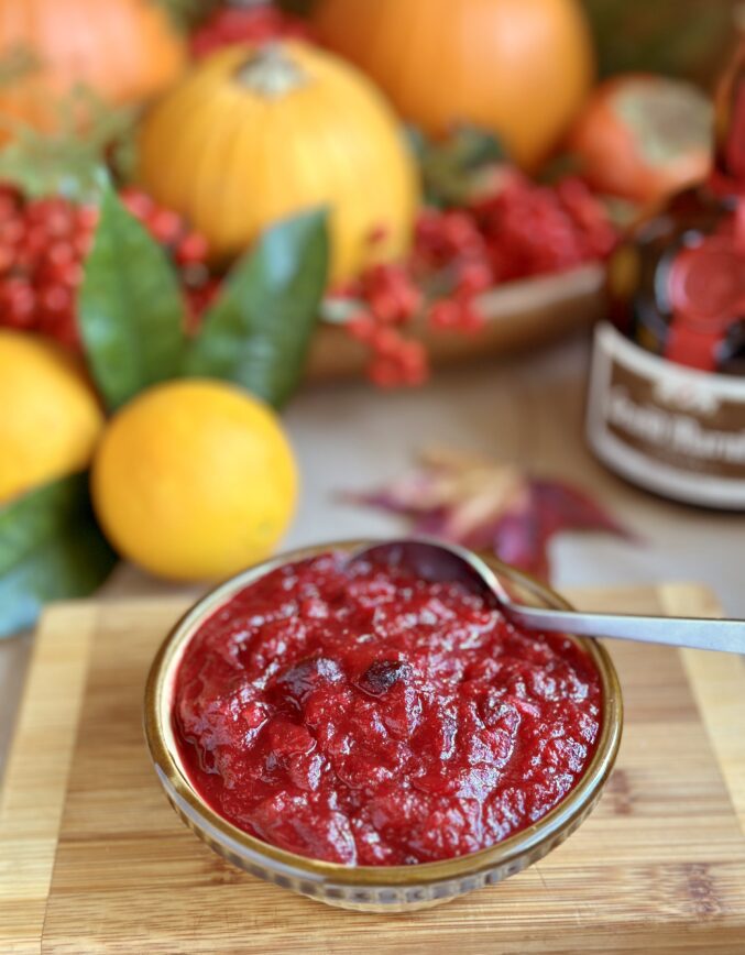 cranberry orange sauce with citrus in background and Grand Marnier