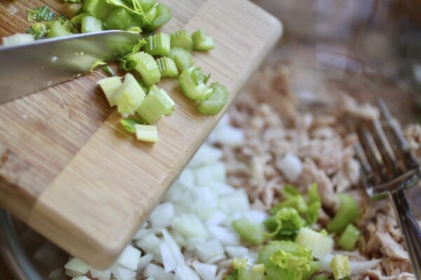 Adding chopped celery