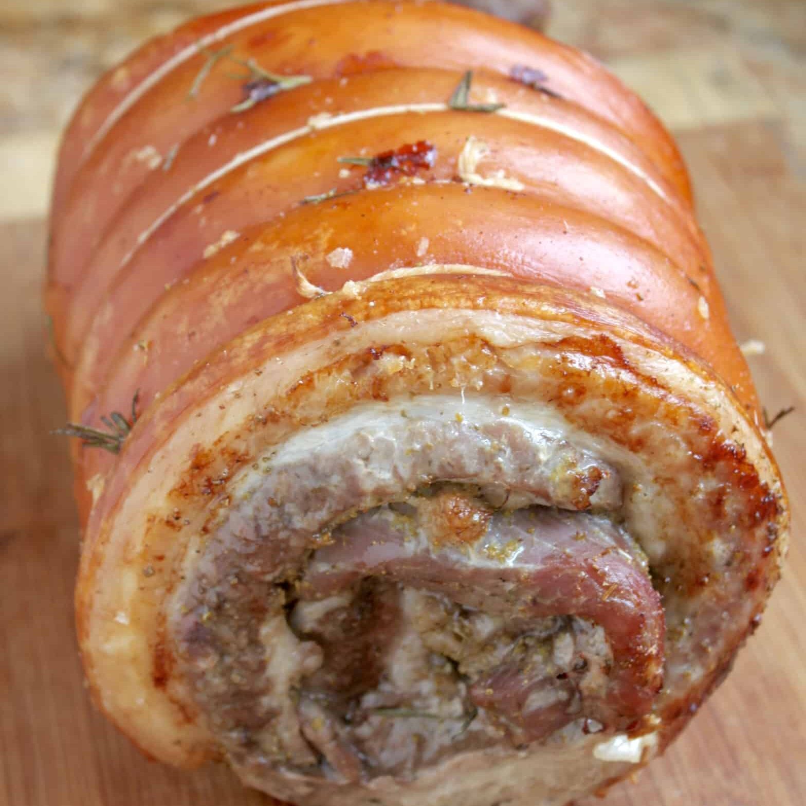 uncut porchetta on a board