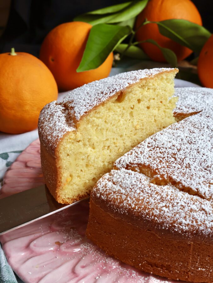 slicing orange olive oil cake