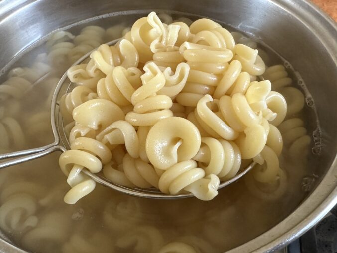 draining cooked trottole pasta