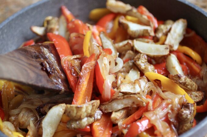 tossing veg in pan